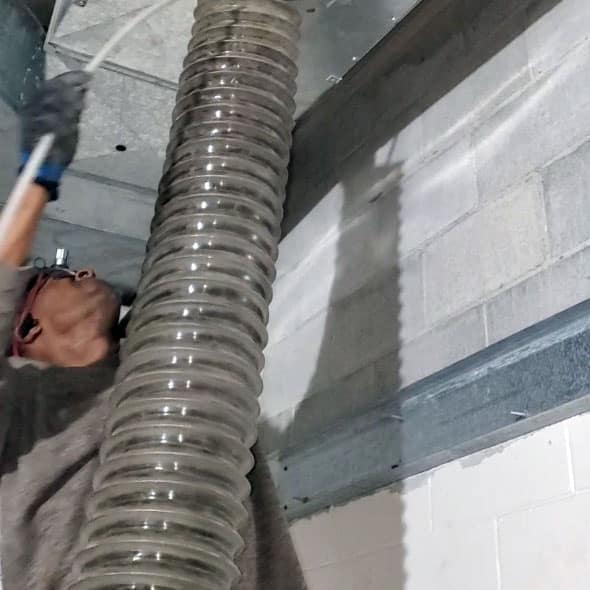 J&K Power Vac Services employee cleans air ducts